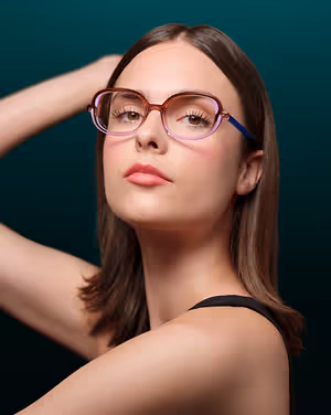 Portrait of a woman with glasses and wearing a black sleeveless top