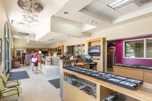 Interior of a business office with glass cabinets and monitors