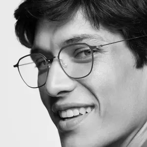 Close up of a smiling man's face wearing glasses