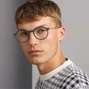 Man with glasses posing for a photo