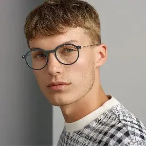 Man with glasses posing for a photo