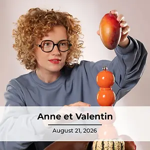 Anne holding a mango over an orange pepper grinder and a pumpkin on a white background.