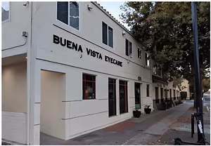A white building with the words Buena Vista Eyecare on it.