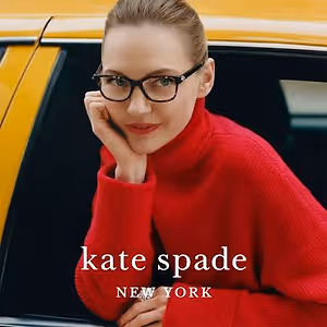 Kate Spade ad featuring a woman in a red turtleneck sweater and glasses