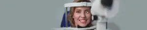 Close up of woman having her eyes examined by a doctor in an optician office.