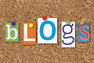 Word Blogs spelled out in colorful letters on a corkboard