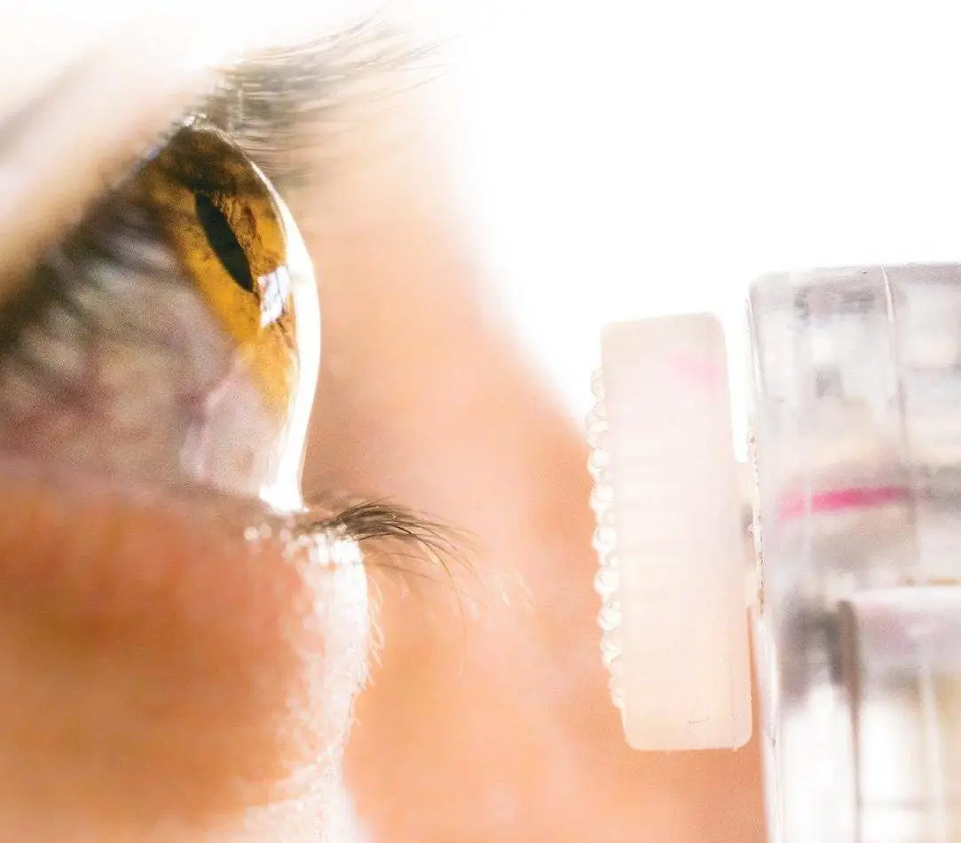 Close up of a person's eye with a contact lens.