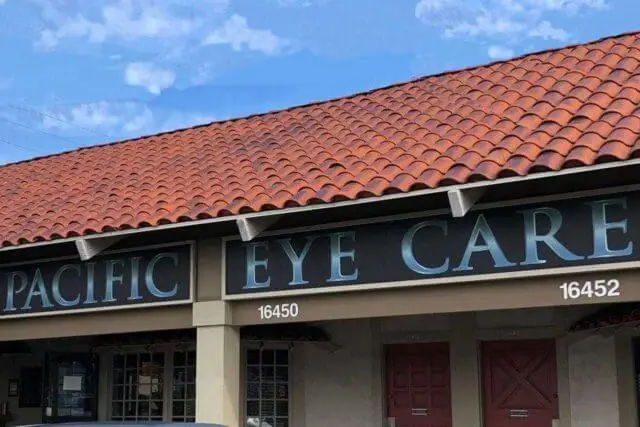 Pacific Eye Care storefront with a red roof and blue sky