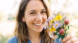 Woman with a bouquet of flowers outdoors