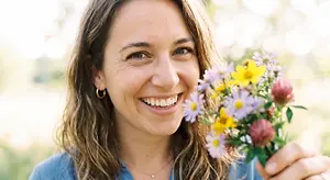 Woman with a bouquet of flowers outdoors