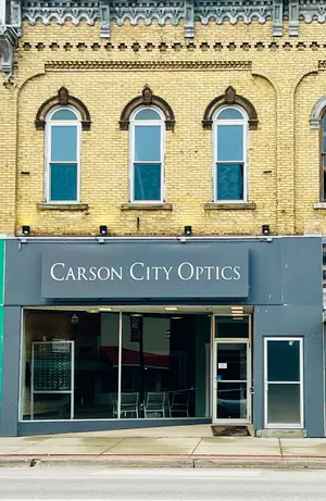 Carson City Optics storefront with glass windows and a sign
