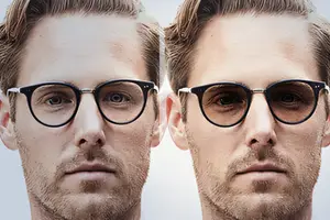 Two male faces side by side, one wearing glasses and the other not, both staring at the camera with serious expressions.
