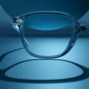 A pair of clear frame glasses reflecting a circular pattern on a blue background