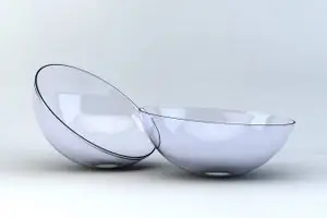 Two transparent glass bowls on a white surface with a black border around the top of each bowl