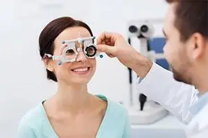 An eye doctor checking the patient's vision