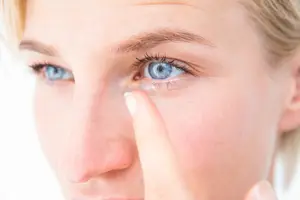 woman wearing colored contact lenses and looking at the camera