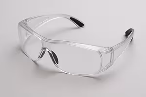 Clear safety glasses with black frames against a white background