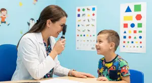 pediatric optometrist examining a child's eyes