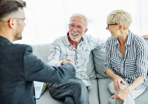 Senior couple consulting with an eye care specialist at Visionaire Eye Care