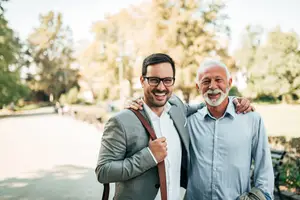 Senior father and son discussing glaucoma care and vision health at Visionaire Eye Care