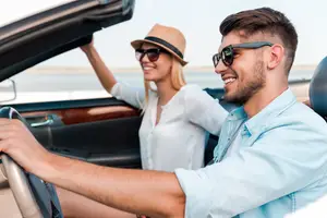 Happy couple wearing sunglasses from North Coast Eye Care in Ohio