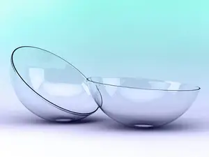 An image of two empty clear glass bowls with black lines on the edges, one bowl's lid is placed on the side of the other bowl