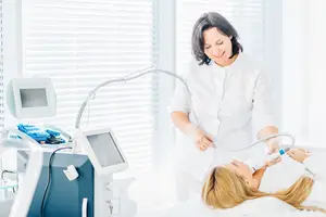 A woman receiving a treatment at a beauty clinic