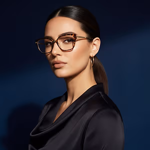 A woman with glasses and a black dress