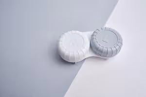 A pair of contact lenses labeled R and L on a white background