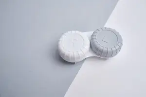 A pair of contact lenses labeled R and L on a white background