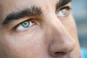 Close up of a man's face, focusing on his eyes and nose.