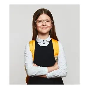 A young girl wearing glasses and a yellow backpack is posing for a picture with her arms crossed.