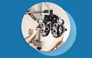 Person adjusting the lenses on an optometrist machine