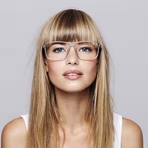 a blonde woman with bangs wearing glasses