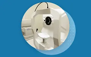 An image of a white CT scan machine with a blue background