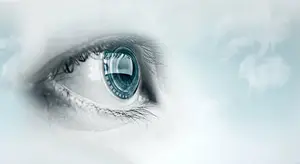 A close-up of a human eye with a blue iris and a blue circle in the middle
