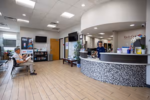 A patient waiting for his eye care appointment at Kudo Care Center in Irving, TX