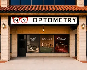 Exterior of an optometry store showcasing luxury brand glasses in the window display
