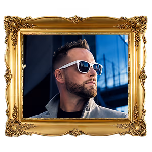 portrait of a man with a beard wearing white sunglasses in a gold frame