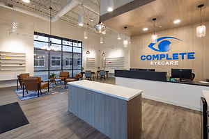 Complete Eyecare interior featuring a reception desk and modern decor