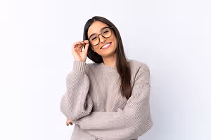 woman wearing glasses and smiling at the camera
