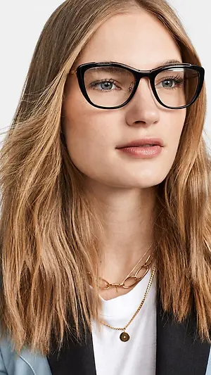 Close-up portrait of a woman wearing black eyeglasses