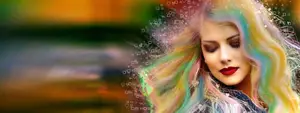 A woman with rainbow-colored hair and red lipstick stands with her eyes closed, likely posing for a photograph, against a colorful background with a blurry effect