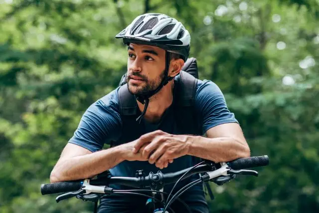 A man riding a bike in the woods