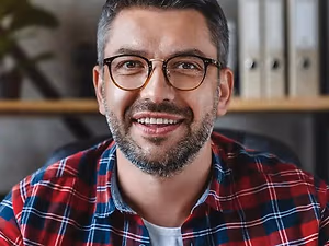 Business man sitting in a chair and smiling