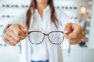 doctor holding glasses