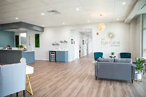 Interior of a modern eye care studio with wooden flooring and furniture