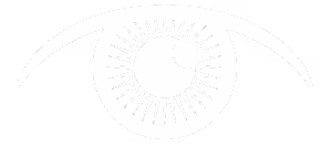 A woman is standing in a white room with a white wall behind her. She is wearing a black and white dress with a black belt. She is holding a white object in her hand and is looking down at it. The image has a black border on the top and bottom. The image has a watermark in the bottom right corner.