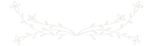 A white floral design on a black background resembling a wreath or a banner