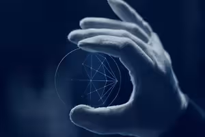 A hand wearing a white glove holds a glass disk with a geometric pattern on a blue background.
